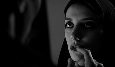 A girl walks home alone at night